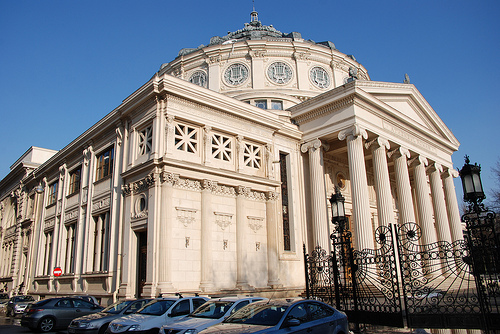 The Romanian Athenaeum (Romanian: Ateneul Roman) is a concert hall in the center of Bucharest, Romania and a landmark of the Romanian capital city. Opened in 1888, the ornate, domed, circular building is the city's main concert hall and home of the "George Enescu" Philharmonic and of the George Enescu annual international music festival. http://en.wikipedia.org/wiki/Romanian_Athenaeum